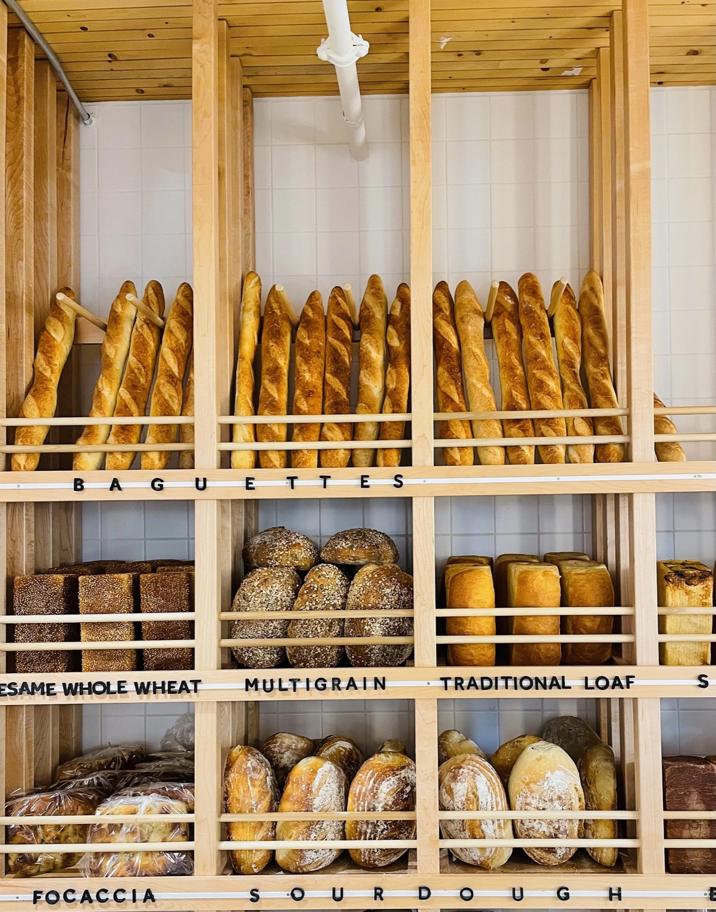 Baguettes and loaves on the bread wall